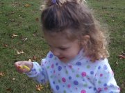 child blowing soap bubbles